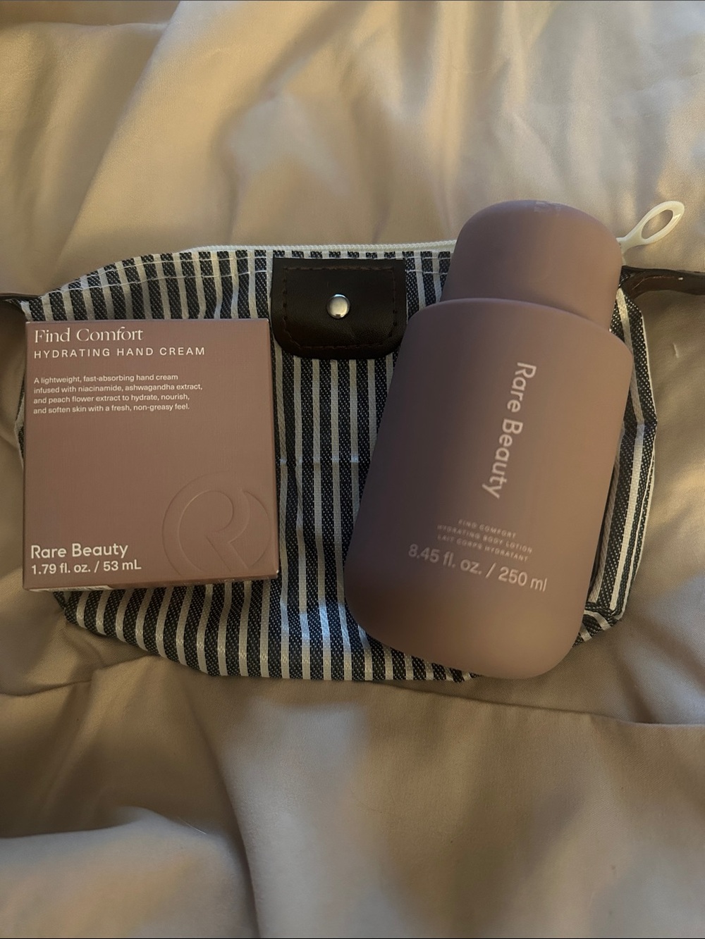 Rare Beauty Find comfort hand cream and body lotion with bag